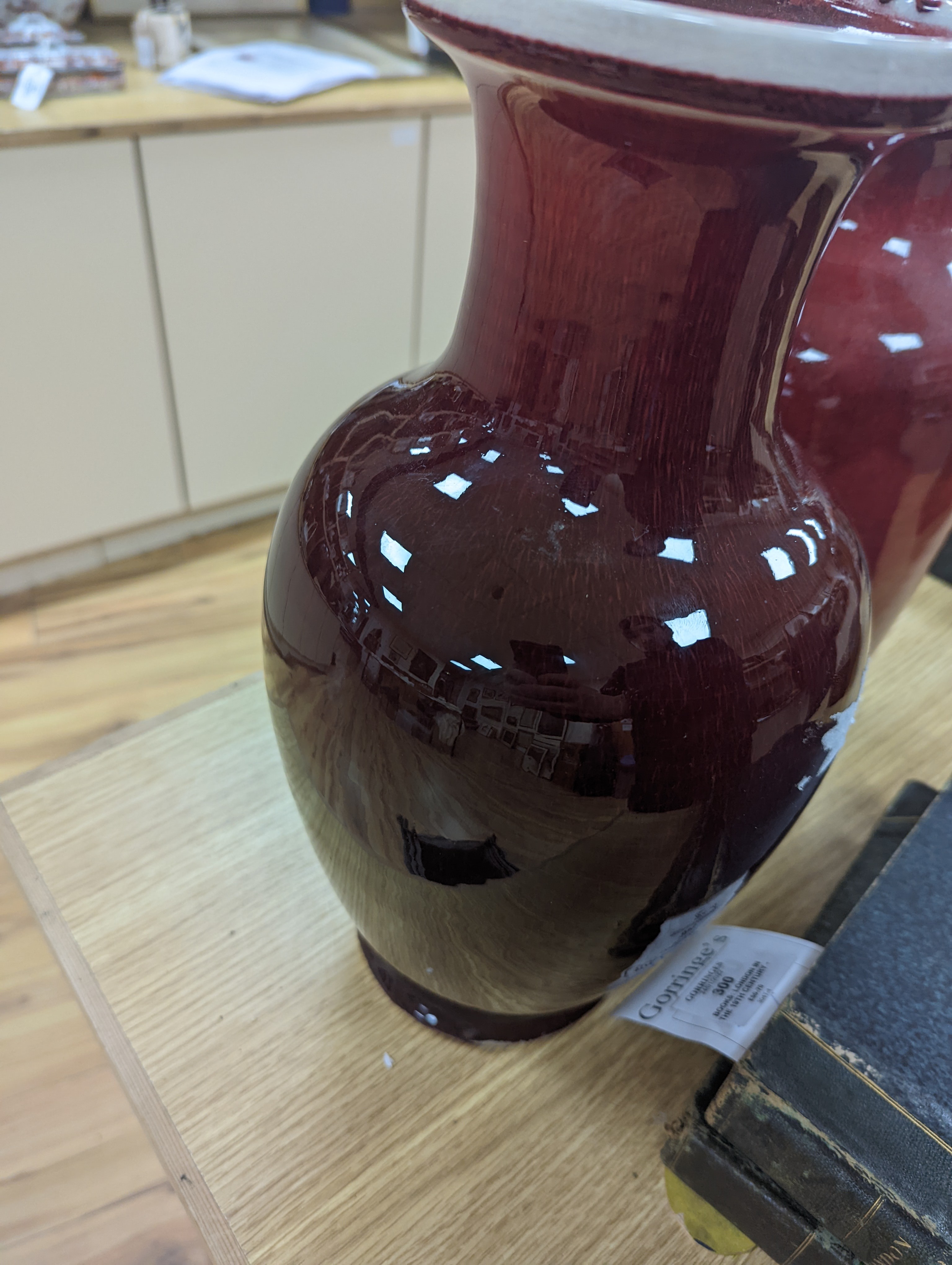 Two large Chinese sang de boeuf glazed vases tallest 36cm